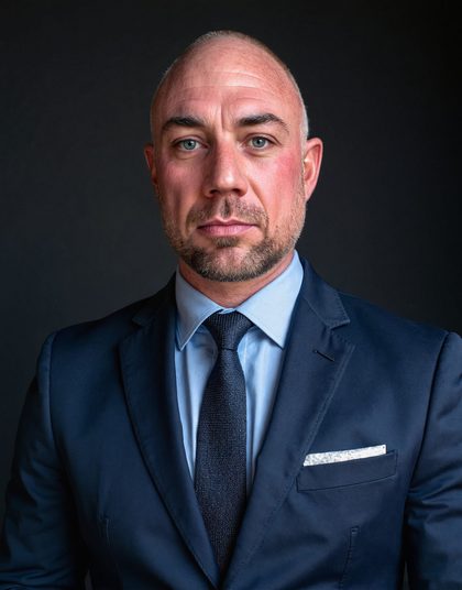 Headshot, studio, dark background